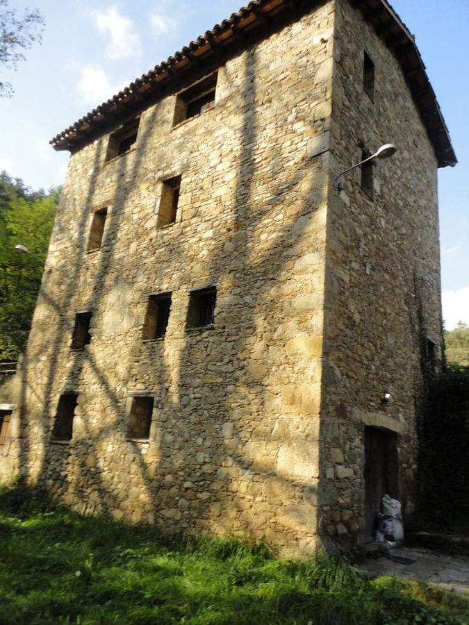 Stone façade of the Molí de Cirera, in Borredà