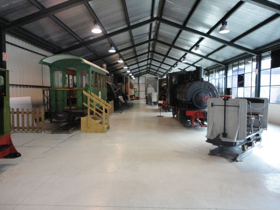 Hall of the Tren del Ciment station museum with restored locomotives and carriages, La Pobla de Lillet